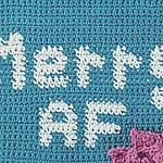 Close up of graph section of crochet wall hanging that says "Merry AF" Represents the graph section of the pattern.